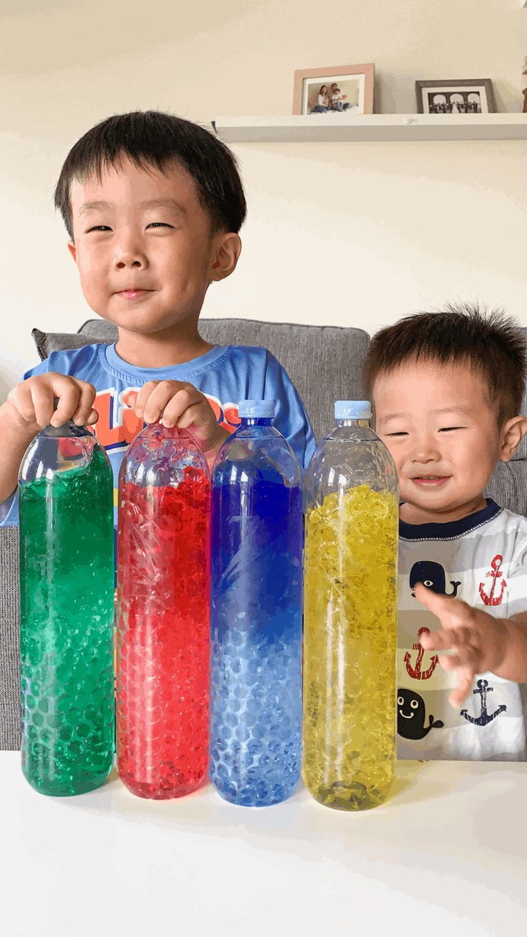 How to Make Rainbow Sensory Bottles - Discovering Mommyhood